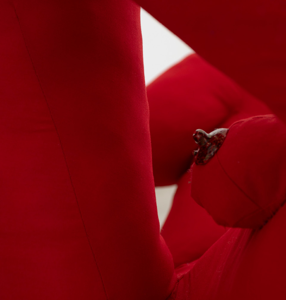 Detail of the red textile figure